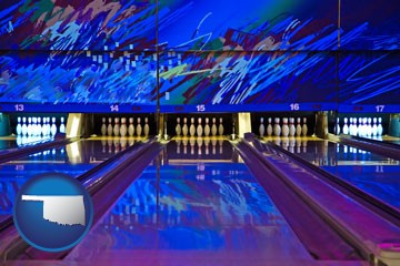 a bowling alley with an abstract wall mural - with Oklahoma icon